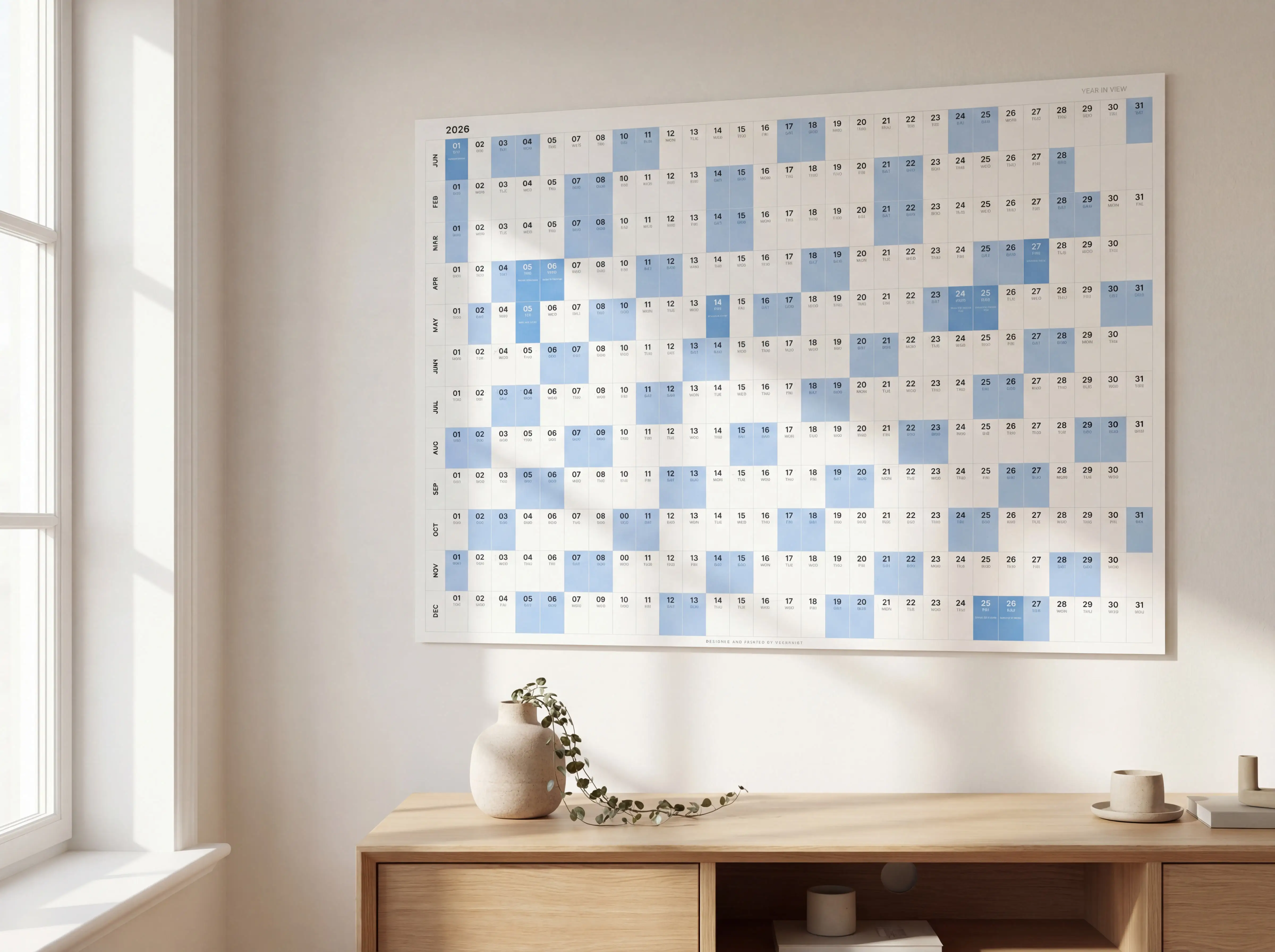 Yearprint calendar on a warm white wall in a Scandinavian living room